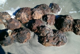 US civil war cannonballs unearthed on beach after Hurricane Matthew